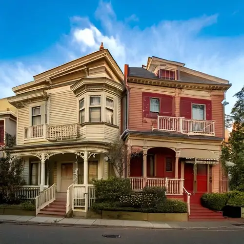 Two Victorian houses side by side in a town